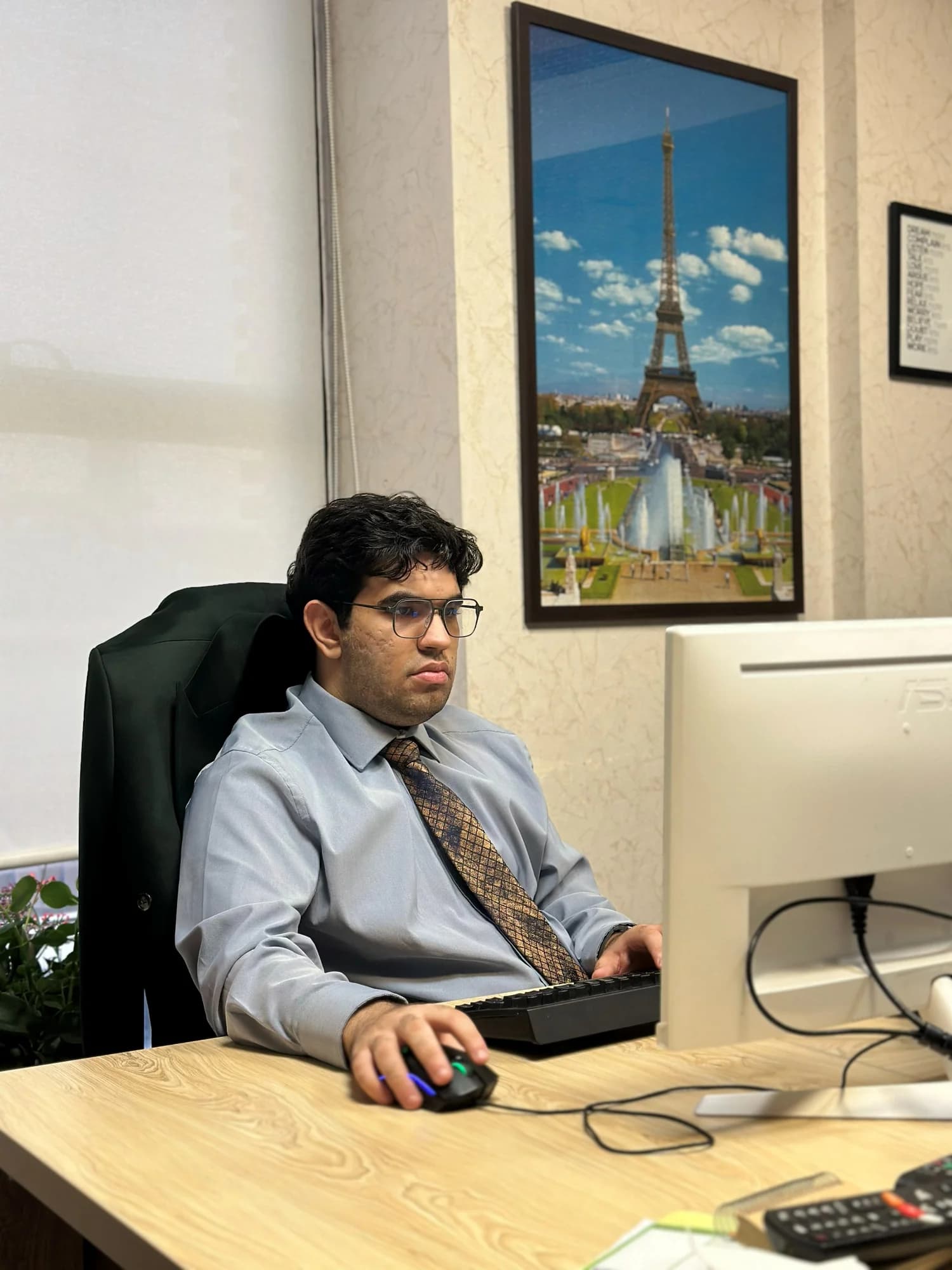 SeyedAli Emami working at a computer in an office